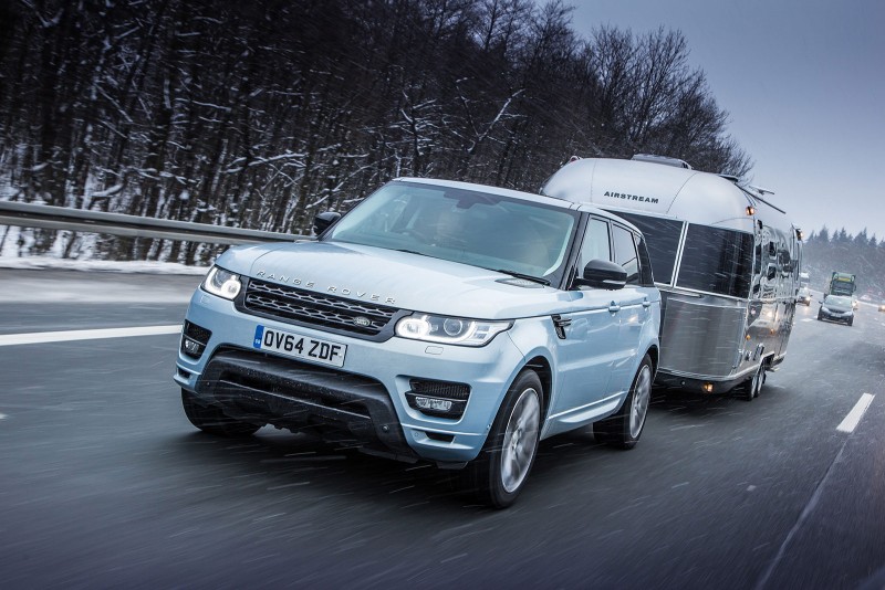 Range Rover Sport Hybrid towing Airstream in the snow